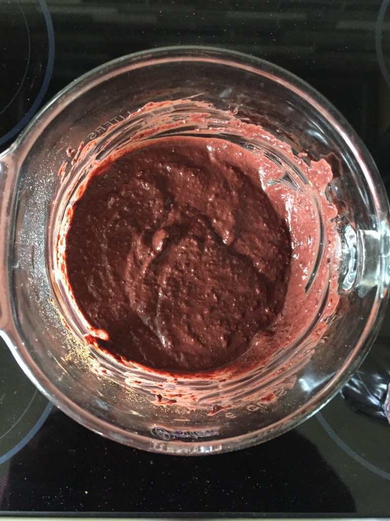 A thick, brown batter with a red hue.