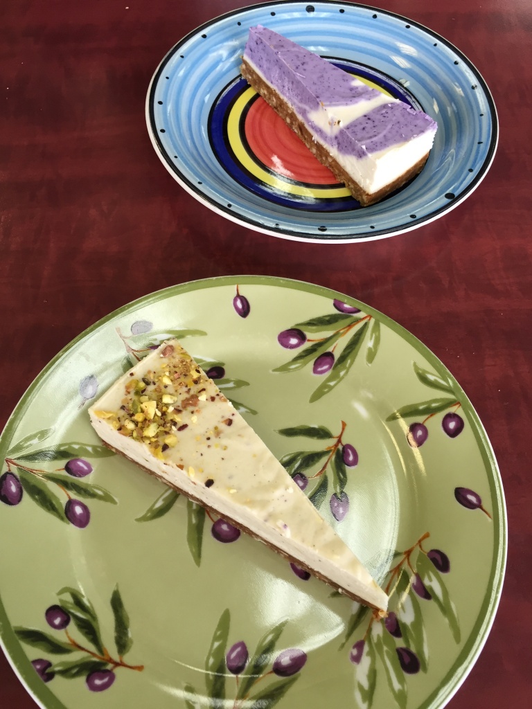 Blueberry lavender and pistachio vegan cheesecakes.