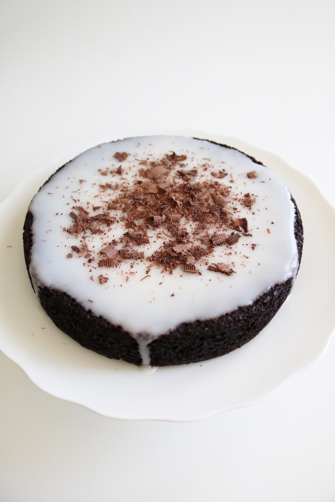 Vegan chocolate cake with coconut yogurt glaze.